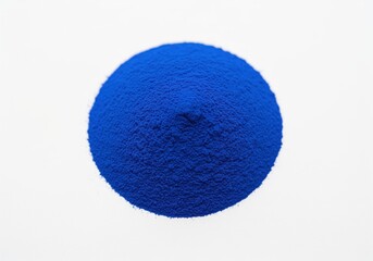 High resolution macro shot of a perfectly smooth circular mound of vivid cobalt blue pigment powder on white