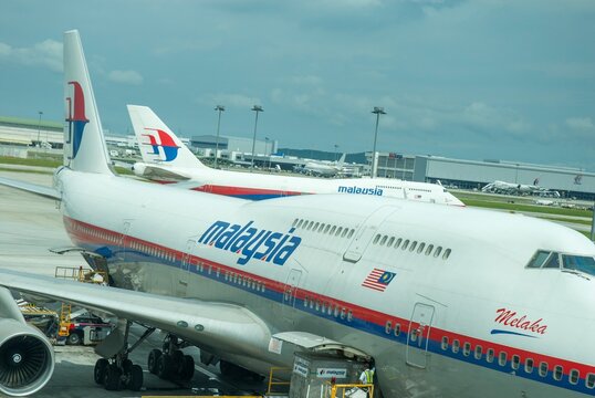 Malaysia Airlines Boeing 747-400 jumbo jet prepares for passengers to board, as ground crew prepares the plane for the flight  in KLIA, Sepang, Malaysia.