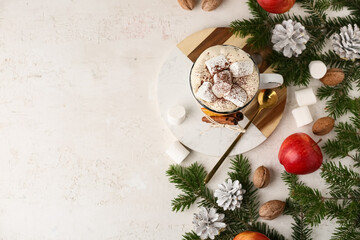 Winter composition with mug of cacao, apples, forest bumps and fir branches on white background, top view