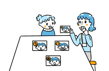 言葉カードで発音を学ぶ子ども