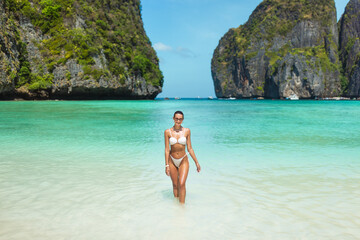 Confident Woman In Bikini Walking From Sea At Maya Bay Thailand
