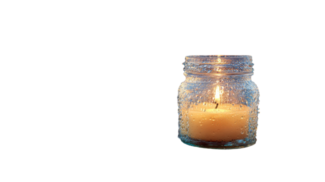 A glowing jar candle emitting warm ambient light with soft illuminated wax details shown clearly on white background