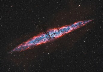 Cosmic nebula formation celestial structure in space with blue and red hues
