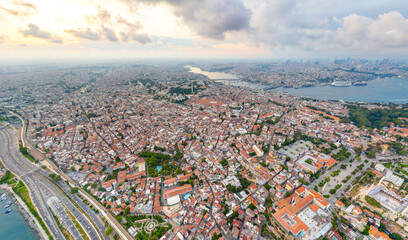 Istanbul, Turkey Drone captures Sultanahmet Square Blue Mosque Hagia Sophia at sunset with cloudy skies. Aerial view