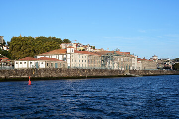 Alfandega Building, formerly New Customs House, on Douro River in Porto, Portugal on clear sunny September afternoon.