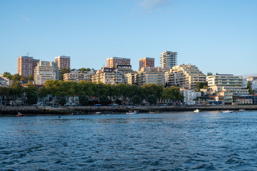 Fototapeta premium Residential buildings on Douro River in Porto, Portugal under clear afternoon sky.