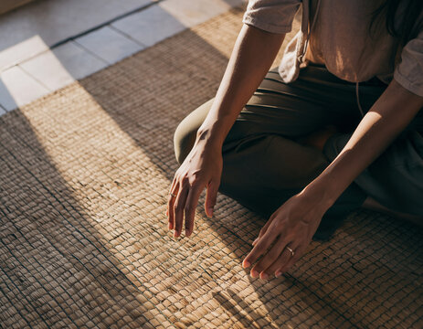 Person practicing mindfulness and deep breathing on the floor meditation mental heath