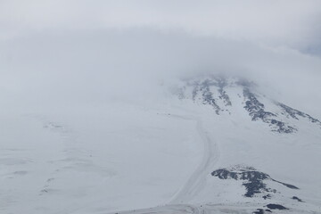 Mountain landscape of Mount Elbrus in heavy fog