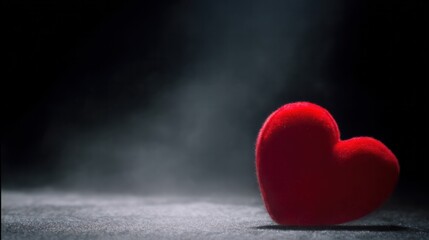 A large glowing red heart floating over a black velvet background, creating a romantic and dramatic effect. gardening catalogs.