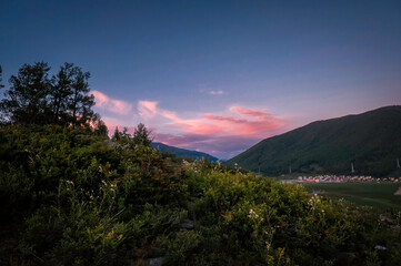 Fototapeta premium sunset over a hilly landscape