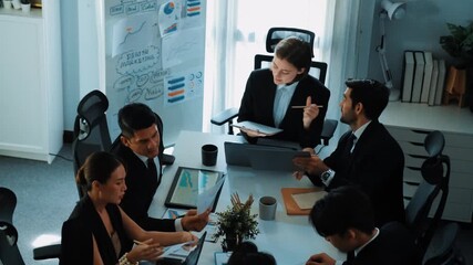 Top view of investor handed financial document to manager while explain marketing idea at meeting table. Diverse people looking at growing graph while listen business team discussion. Directorate. - Powered by Adobe
