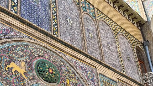 Triple gate architecture in Islamic design colorful tiles of mosaic pattern royal mansion Golestan palace historic landmark decorative exterior beauty capital Tehran Persia heritage travel destination