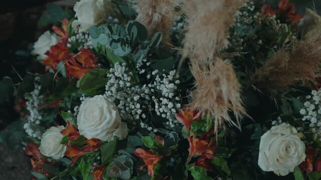 detailed closeup of roses greenery and delicate wedding florals