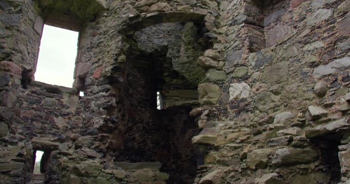 Mid Tilting up shot of the inside ruined Knock castle,