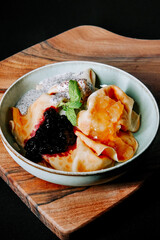 Delicious dessert bowl with fruit compote and mint garnish