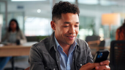 Phone, happy and businessman in office with networking, communication or social media on mobile app. Smile, technology and male person with cellphone for contact, email or texting in workplace.