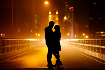 Romantic silhouette of a couple embracing on a city bridge at night, bathed in warm orange streetlights and city glow, conveying love and urban romance.