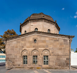 Tomb of Zeynel Abidin, also known as Zeynel Abidin Turbesi, a historic stone building with an octagonal dome under a clear blue sky in Kayseri, Turkey