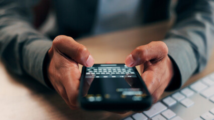 Hands, phone screen and text message with business person at desk in office for communication. App,...