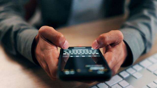 Hands, phone screen and text message with business person at desk in office for communication. App, fingers and typing with employee in workplace for mobile chatting, post update or reply closeup