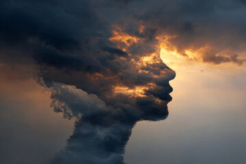 Dramatic cloudscape forming a human profile with vibrant golden light, symbolizing inner thoughts, dreams, and the power of imagination for creativity and inspiration