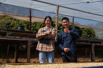People inspect the roasting of coffee beans in large metal vats, which are a blend of Arabica and Robusta coffee beans to produce high-quality coffee with excellent taste.