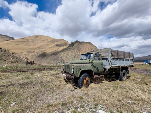 An old ZIL truck standing among the mountains