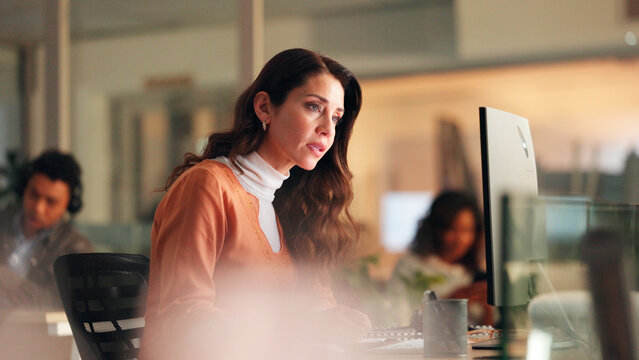 Night, woman or worry with computer in office for journalism ethics fail, bad review or problem. Late, concerned writer or coworking with pc for plagiarism report, fake news issue or reputation risk.