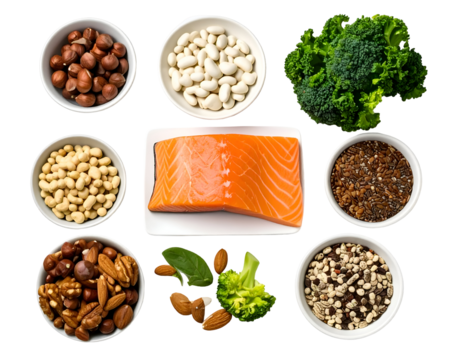 Fresh salmon fillet surrounded by assorted nuts, seeds, and vegetables on a white background