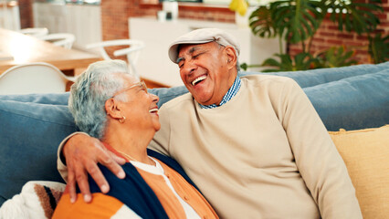 Love, senior couple and laughing on sofa with healthy marriage, conversation joke and bonding. Pensioner, happy elderly people and hug in home with funny discussion, retirement support and connection
