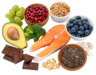 A variety of fresh fruits, nuts, seeds, and a piece of raw salmon arranged together for healthy eating or meal preparation