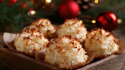 Festive coconut macaroons in wooden tray with christmas ornaments and twinkling lights - Powered by Adobe