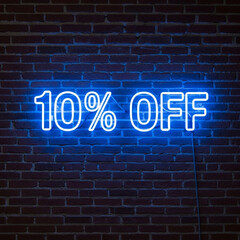 Fototapeta premium Get 10% Off Now with this vibrant blue neon sign on a brick wall, perfect for retail promotions and advertising your limited time offers!