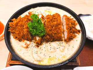 Spicy Indian chicken curry with tomato, onion, and rice in a delicious hot dinner bowl