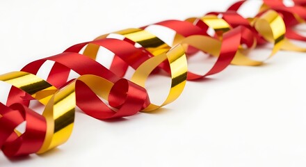 Festive red and gold curling ribbon strands creating a dynamic diagonal line on white background