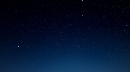 Obraz premium A few scattered stars placed across a deep minimalist night sky.
