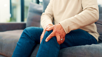 Knee pain, home and senior man on sofa with injury for arthritis, osteoporosis and fibromyalgia....