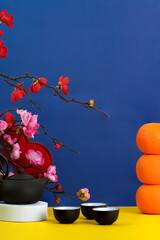 Lunar New Year background with tea set and decorative elements