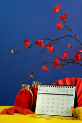 Festive background for Lunar New Year with calendar and decorations