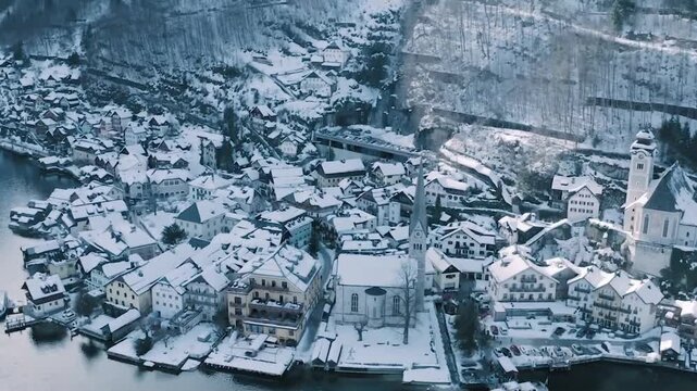 High Angle Aerial Pan of Hallstatt Village Covered in Snow, Austria
