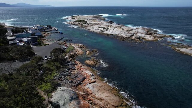 Red Rocks Of Bicheno Blowhole In Tasmania, Australia - Drone Pullback