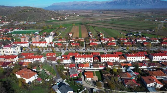 Maliq Buildings and Boulevard: Quiet Town, Socialist Architecture, Korca Field Background