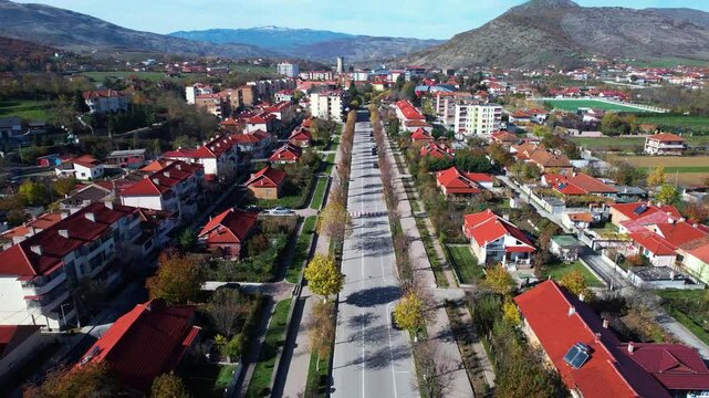 Maliq Town Panorama: Socialist Era Architecture and Scenic Korca Field Views