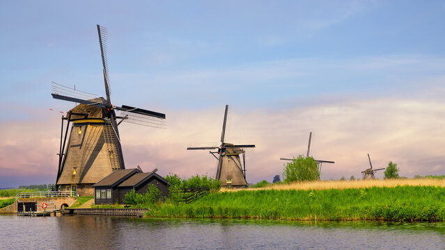 Historic wind mills in a row at UNESCO world heritage site Kinderdijk in the Netherlands.
