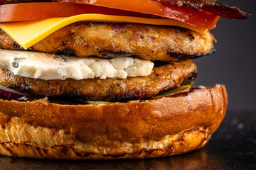Juicy gourmet burger with cheese and grilled chicken patties