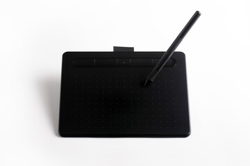 Sleek black digital drawing tablet with pen on a white background, ideal for graphic design, digital art, and creative professionals.