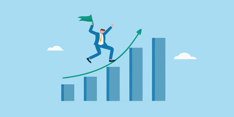 Businessman celebrating success on a rising chart with a flag in hand