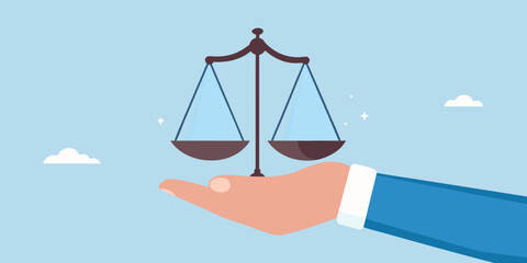 Hand holding scales of justice symbolizing fairness and legal balance