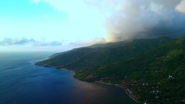 Morning Aerial View Of Amed Coast With Lush Green Hills And Calm Blue Sea