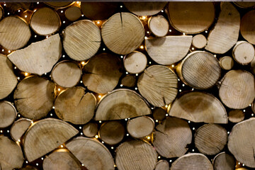 stack of firewood Shows stacked wooden logs. Full-frame composition, brown-beige tone. Realistic style, nature background
